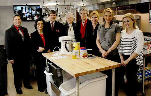 Relatives of Maudine Sanders toured the culinary kitchen teaching laboratory in the School of Human Environmental Sciences funded by part of her bequest to the University of Arkansas. Pictured are, from left, Dean Michael E. Vayda, Dale Bumpers College of Agricultural, Food and Life Sciences;  Beverly Charleton; Robert Harrington, coordinator of the foods, human nutrition and hospitality major; Wilma and Carol Sutton; Linda Hogg; Brooke Johnston and Jorja Johnston.