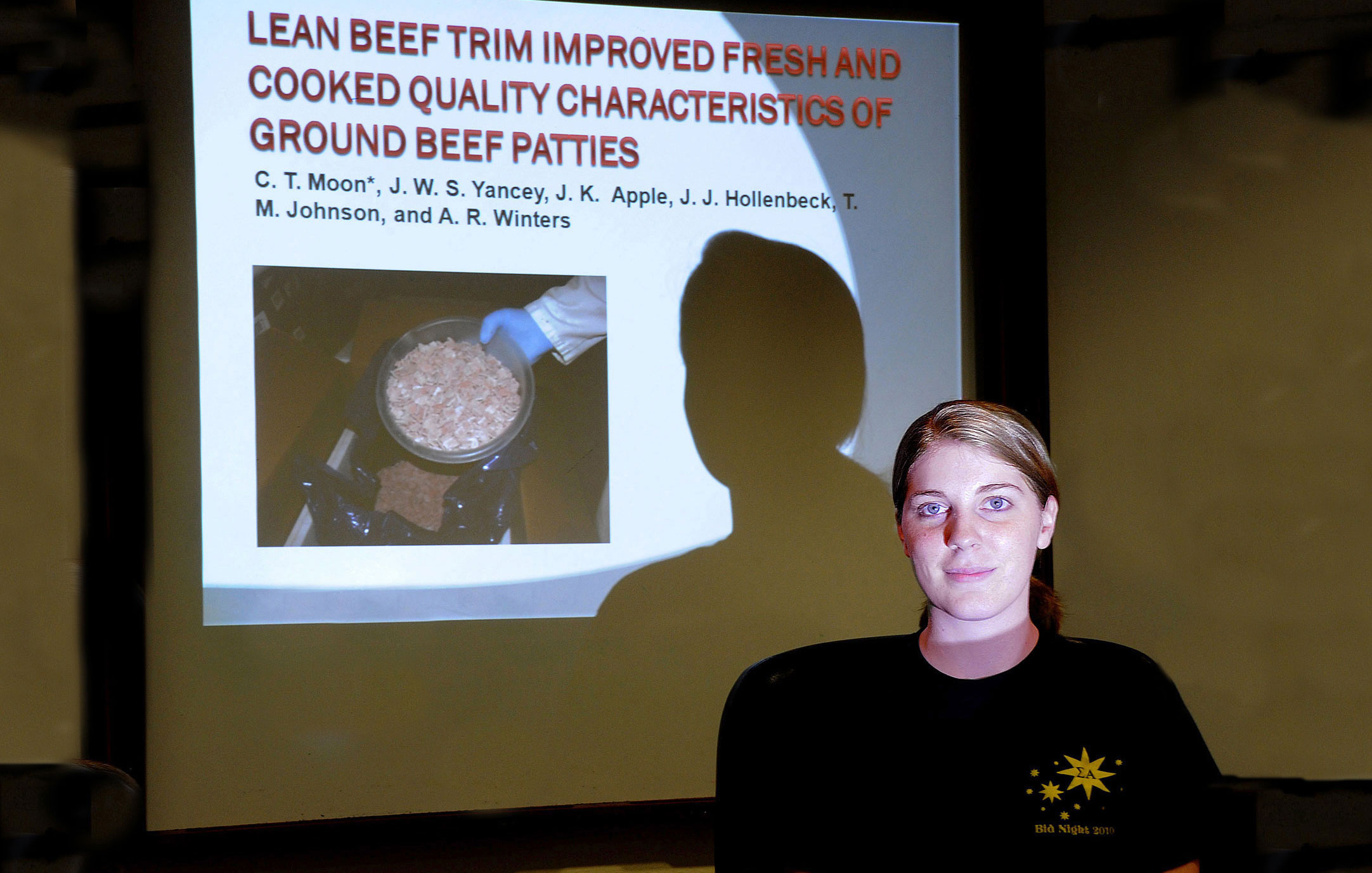 Courtney Moon shows the title slide from her presentation on a research project that found that ground beef patty quality was improved by adding "lean finely textured beef." 

